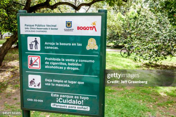 Bogota, Colombia, Parque Chico Reservado II, public park rules sign, no littering, use trash cans, clean up after dog, no smoking or drinking allowed.