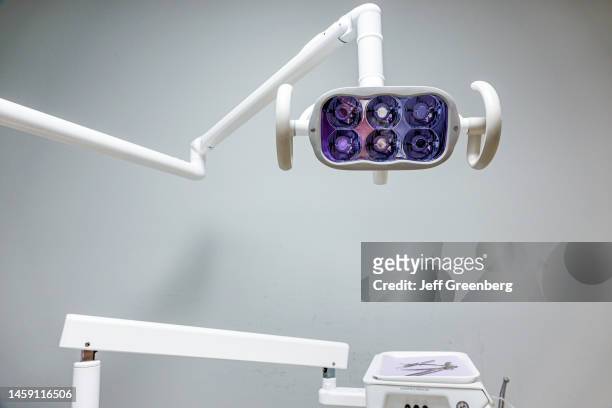 Miami Beach, Florida, dental office exam room, overhead light, tool tray.