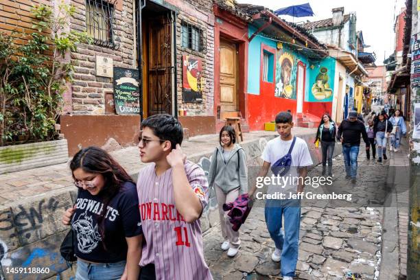 Bogota, Colombia, La Candelaria, historic district, Carrera 2 Calle del Embudo, group of teenage pedestrians walking down street.