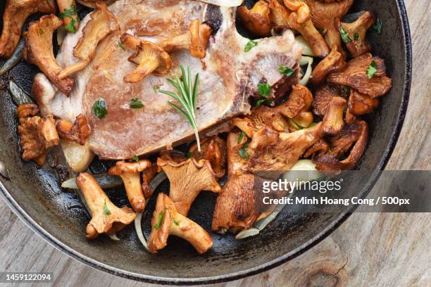 directly above shot of meat in pan on table,france - shiitake mushroom stock pictures, royalty-free photos & images