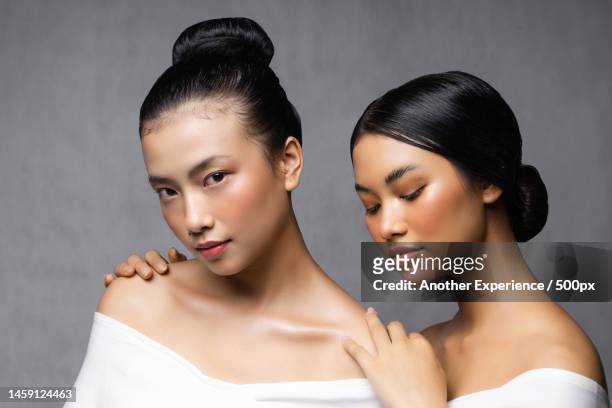 two beautiful women looking at camera,indonesia - beauty editorial stock pictures, royalty-free photos & images