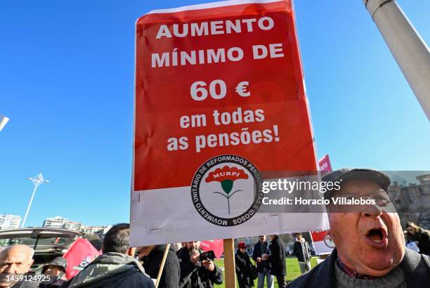 Pensioners hold posters while gathering to protest in Alameda Dom Afonso Henriques against the rising cost of living on January 24 in Lisbon,...