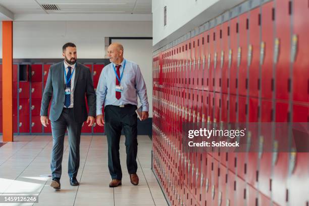 walking to class - principal stock pictures, royalty-free photos & images