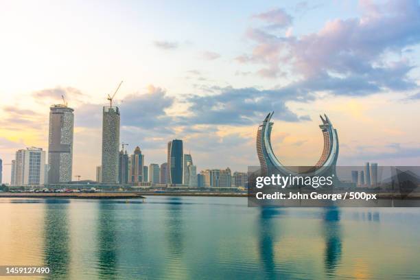 view of city at waterfront,lusail,qatar - qatar skyline stock pictures, royalty-free photos & images