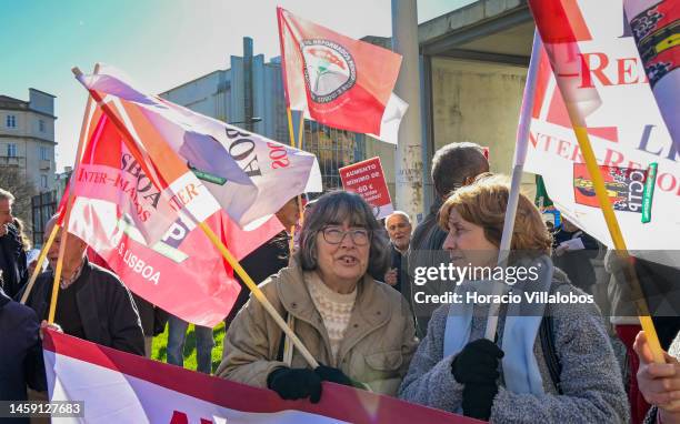 Pensioners hold posters and flags while gathering to protest in Alameda Dom Afonso Henriques against the rising cost of living on January 24 in...