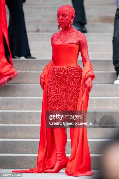 Doja Cat wears a red Schiaparelli total look and red makeup all over the body, outside Schiaparelli, during Paris Fashion Week - Menswear Fall-Winter...