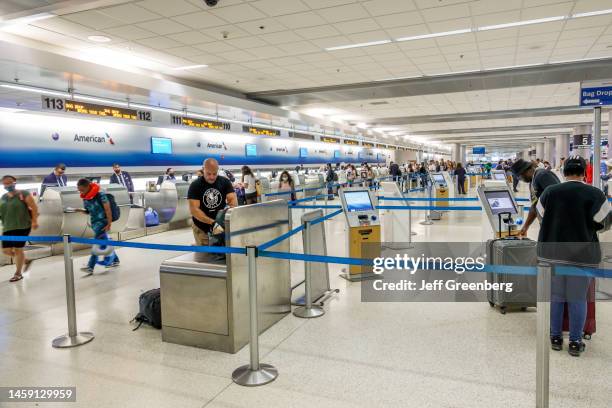 Miami, Florida, Miami International Airport MIA terminal, American Airlines flight check-in lines and passengers.