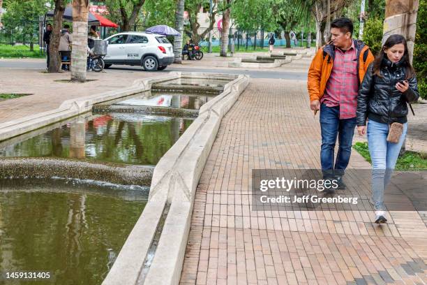 Bogota, Colombia, La Candelaria, Eje Ambiental, San Francisco River canal system with pedestrians on promenade by architects Rogelio Salmona and...