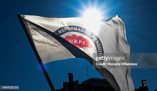 Pensioners wave a MURPI flag while gathering to protest in Alameda Dom Afonso Henriques against the rising cost of living on January 24 in Lisbon,...