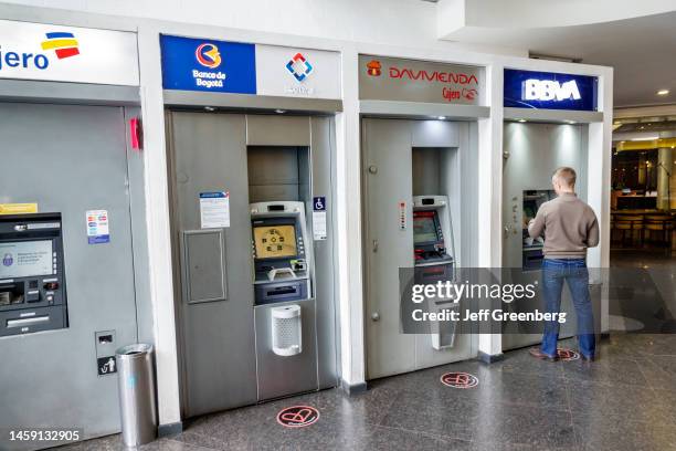 Bogota, Colombia, El Chico, BBVA Cajero Centro Commercial Portobelo ATM, Banco de Bogota Davivienda, man using ATM.