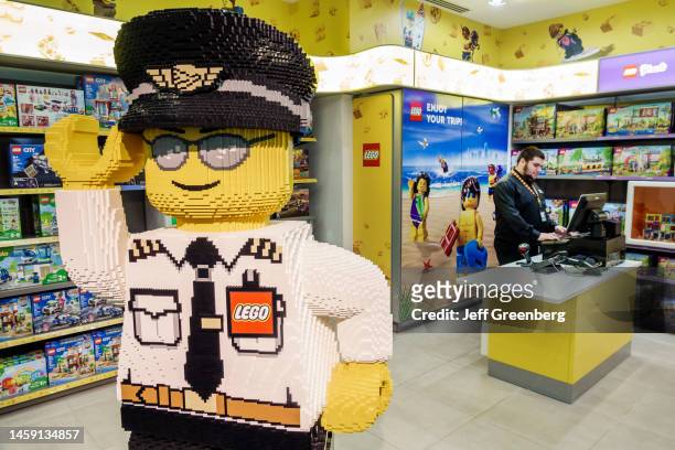 Miami, Florida, Miami International Airport MIA terminal, concourse area, Lego Danish company, toy game store with airline captain statue.