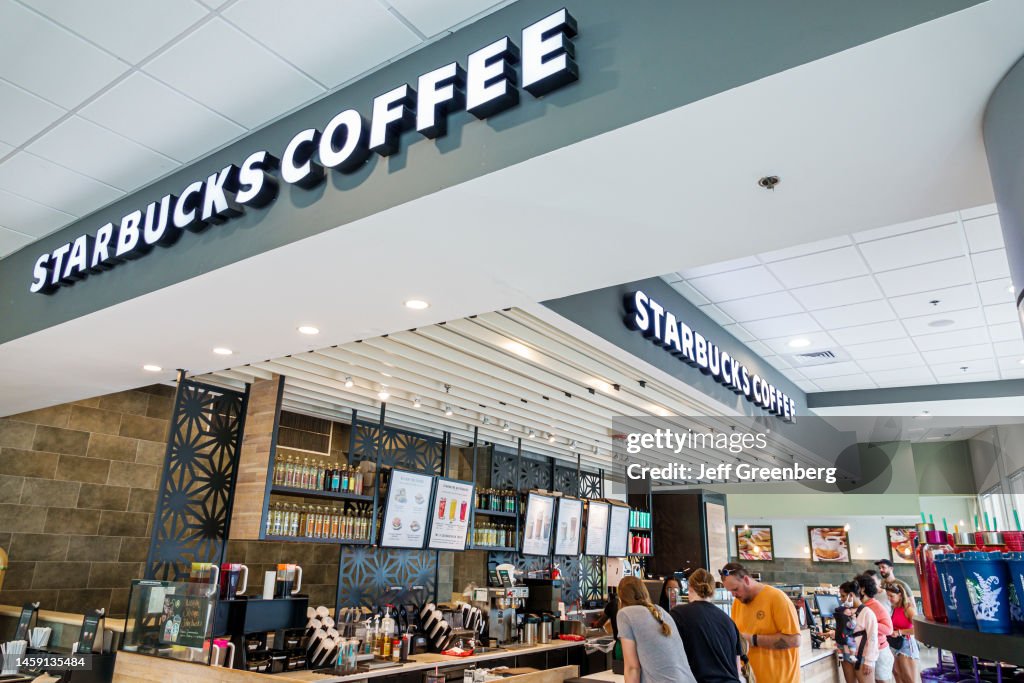 Miami Beach, Florida, Starbucks Coffee shop, barista at counter helping customers