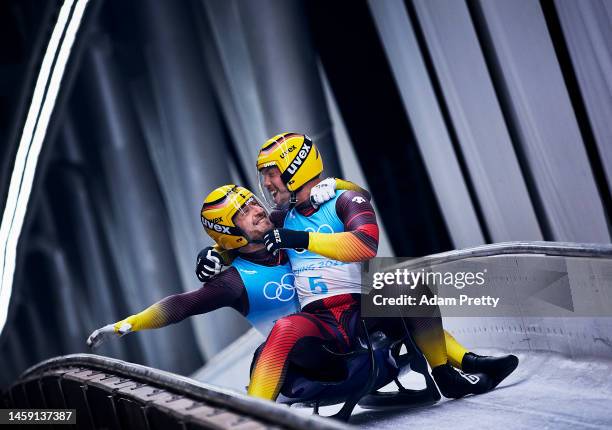 Tobias Wendl and Tobias Arlt of Team Germany react after winning the gold medal in the Luge Doubles on day five of the Beijing 2022 Winter Olympic...