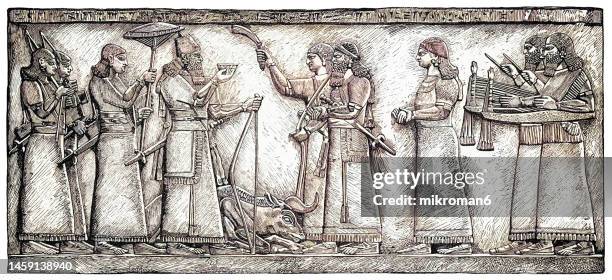 old engraved illustration of assur-napir-apli ii (aschur-nasir-apli or assur-nasirpal) - assyrian king from 883 to 859 bc, brings the gods a drink offering after his victory over the wild bull, assyrian empire - babylonia stock pictures, royalty-free photos & images