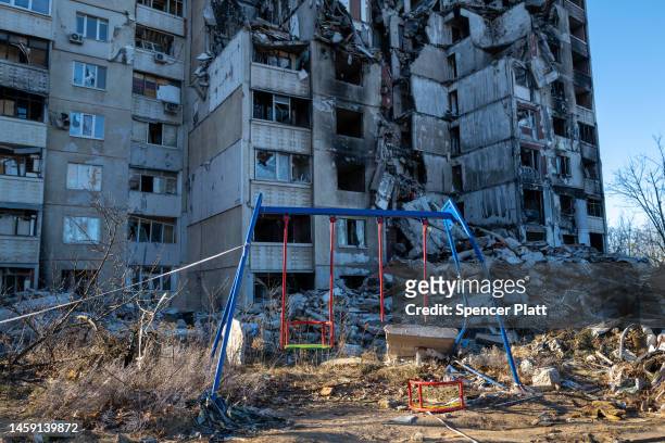 Swing set sits near a destroyed building in a section of Kharkiv that was heavily damaged by the Russians on January 24, 2023 in Kharkiv, Ukraine....