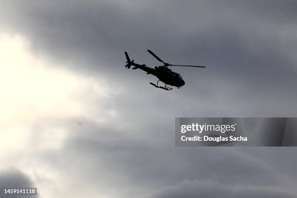 silhouette of a helicopter inflight - clinic stock pictures, royalty-free photos & images