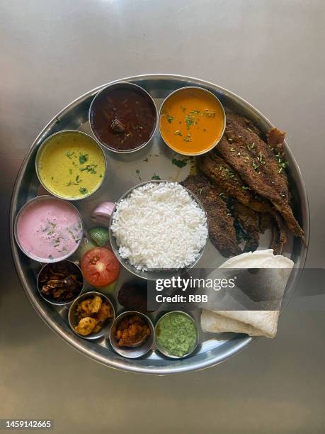 Fish Rice Thali Image Rice Thali Photos and Premium High Res Pictures - Getty Images