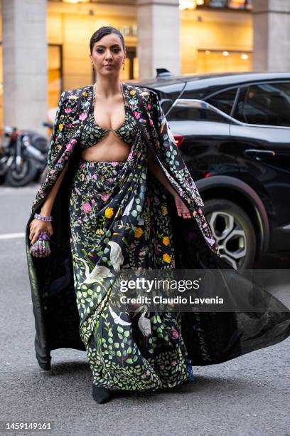 Guest wears a floral print maxi dress and colorful printed maxi kimono, outside Rahul Mishra, during Paris Fashion Week - Menswear Fall-Winter...