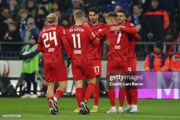 Andre Silva of RB Leipzig celebrates with teammates after scoring the team's first goal during the Bundesliga match between FC Schalke 04 and RB...