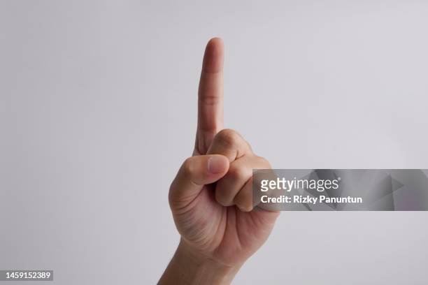 human hand with finger pointing up - index finger stock pictures, royalty-free photos & images
