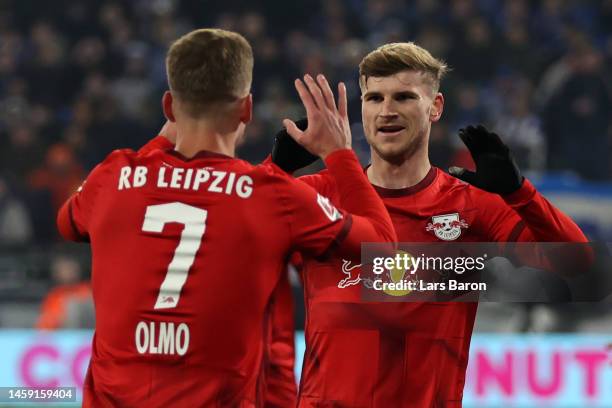 Timo Werner of RB Leipzig celebrates with teammate Dani Olmo after scoring the team's fourth goal during the Bundesliga match between FC Schalke 04...