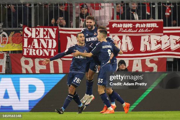 Ellyes Skhiri of 1.FC Koln celebrates with teammates after scoring the team's first goal during the Bundesliga match between FC Bayern München and 1....