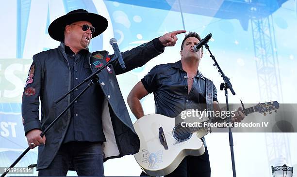 Eddie Montgomery and Troy Gentry of Montgomery Gentry perform during the 2012 CMA Music Festival on June 7, 2012 in Nashville, Tennessee.