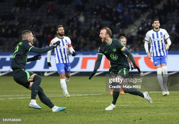 Maximilian Arnold of VfL Wolfsburg celebrates after scoring the team's second goal from a penalty kick with teammates during the Bundesliga match...