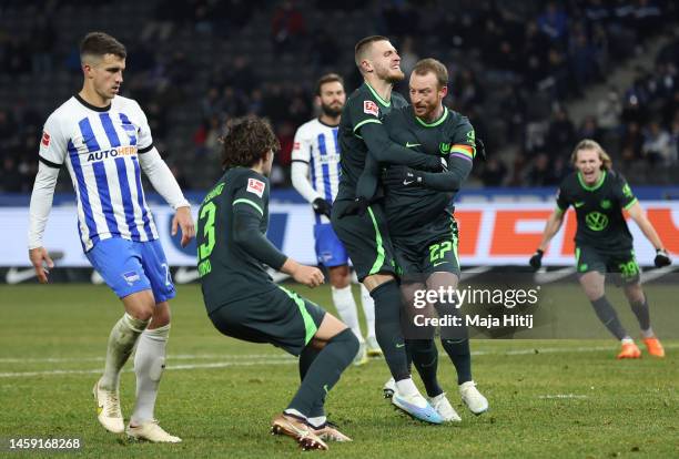 Maximilian Arnold of VfL Wolfsburg celebrates after scoring the team's second goal from a penalty kick with teammates during the Bundesliga match...