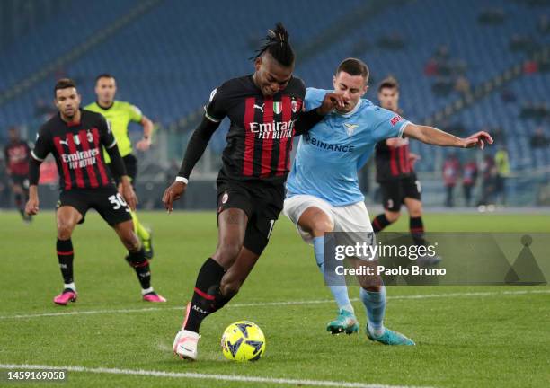 Rafael Leao of AC Milan is challenged by Adam Marusic of SS Lazio during the Serie A match between SS Lazio and AC Milan at Stadio Olimpico on...