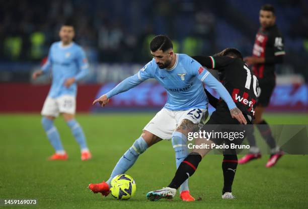 Elseid Hysaj of SS Lazio is challenged by Brahim Diaz of AC Milan during the Serie A match between SS Lazio and AC Milan at Stadio Olimpico on...