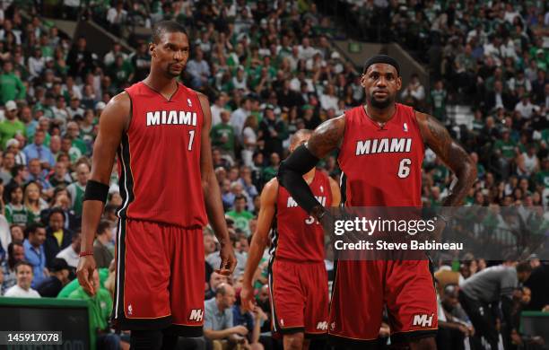 LeBron James and Chris Bosh of the Miami Heat look on against the Boston Celtics in Game Six of the Eastern Conference Finals during the 2012 NBA...