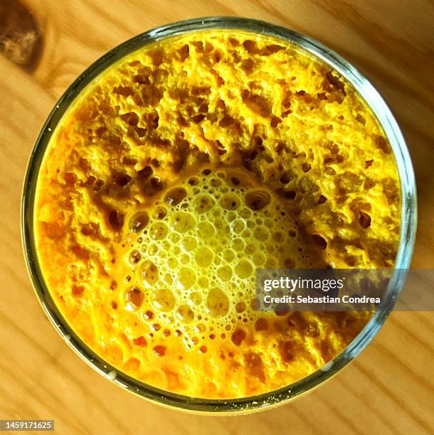 saffron turmeric milk - turmeric stock pictures, royalty-free photos & images