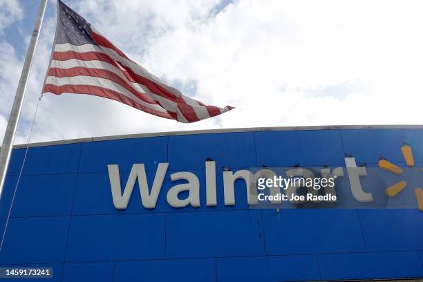 An American flag flies outside of a Walmart store on January 24, 2023 in Miami, Florida. Walmart announced that it is raising its minimum wage for...