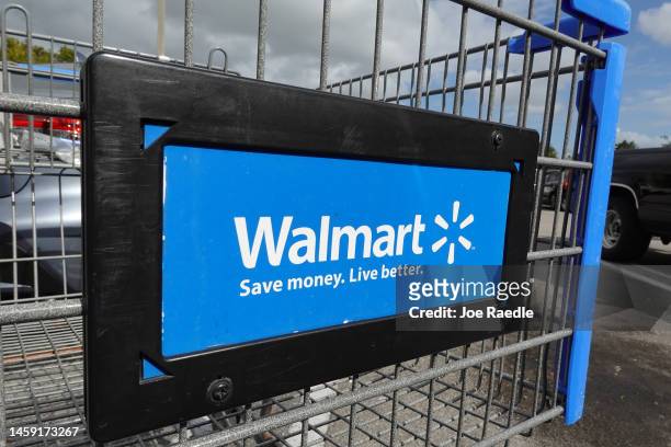 Cart sits outside of a Walmart store on January 24, 2023 in Miami, Florida. Walmart announced that it is raising its minimum wage for store employees...