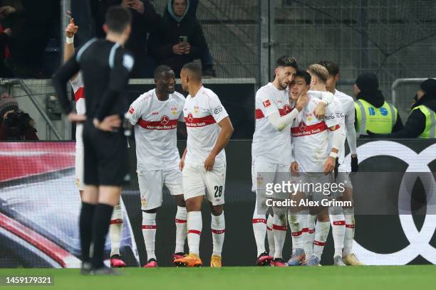 Wataru Endo of VfB Stuttgart celebrates after scoring the team's second goal with teammates during the Bundesliga match between TSG Hoffenheim and...