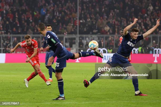 Joshua Kimmich of Bayern Munich scores the team's first goal during the Bundesliga match between FC Bayern München and 1. FC Köln at Allianz Arena on...