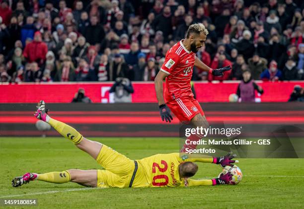 Eric Maxim Choupo-Moting of Bayern is challenged by Marvin Schwaebe of Cologne during the Bundesliga match between FC Bayern München and 1. FC Köln...