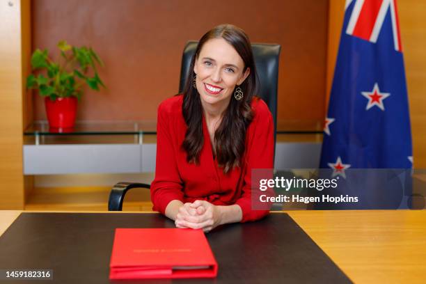 New Zealand Prime Minister Jacinda Ardern poses at her desk for the last time as Prime Minister at Parliament on January 25, 2023 in Wellington, New...