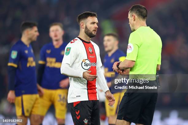 Adam Armstrong of Southampton speaks to Referee Stuart Attwell, after scoring a goal which was dissallowed following a handball decision via a VAR...