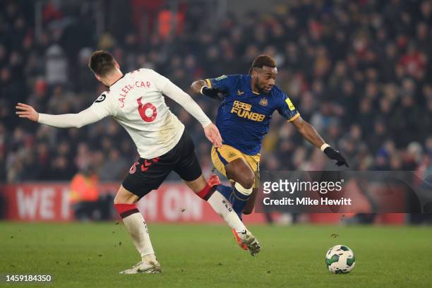 Allan Saint-Maximin of Newcastle United is fouled by Duje Caleta-Car of Southampton, who is later shown a red card by Referee Stuart Attwell during...