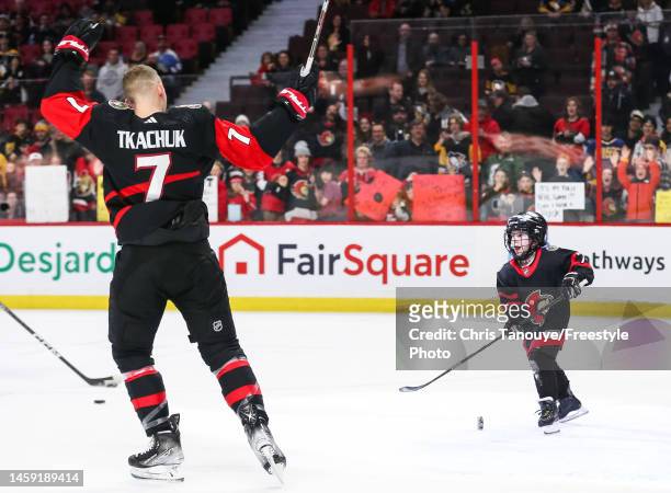Make A Wish Kid, Daniel Maloney, skates during warmup with Brady Tkachuk of the Ottawa Senators prior to an NHL game between the Ottawa Senators and...