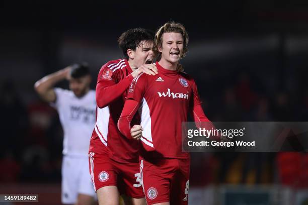 Tommy Leigh of Accrington Stanley celebrates victory with Doug Tharme after the Emirates FA Cup Third Round Replay match between Accrington Stanley...