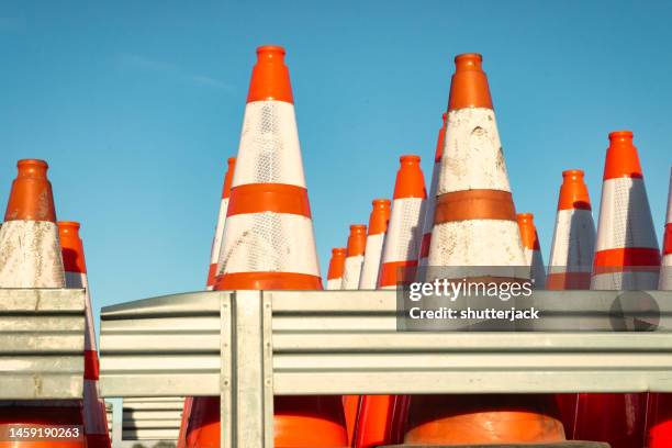 close-up of rows of construction cones on at the back of a truck - road works stock-fotos und bilder