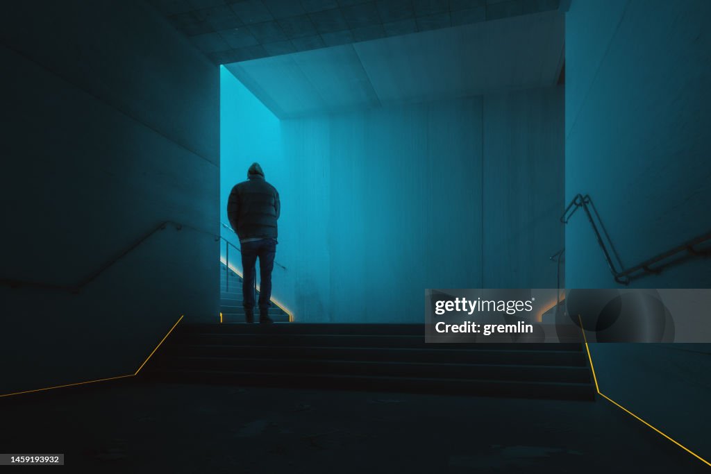 Man walking in underground corridor