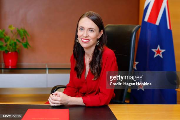 New Zealand Prime Minister Jacinda Ardern poses at her desk for the last time as Prime Minister at Parliament on January 25, 2023 in Wellington, New...