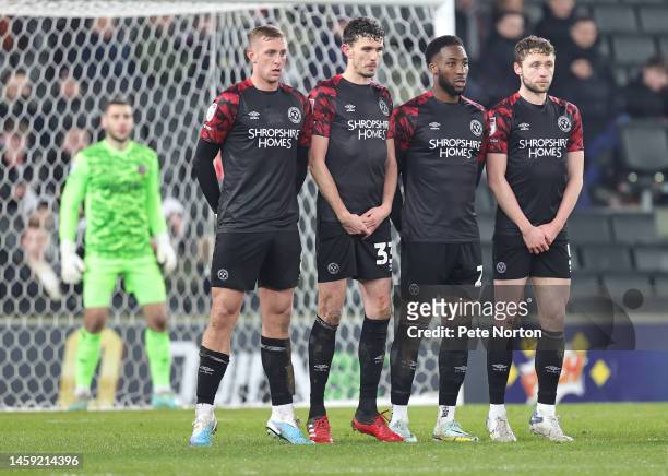 Killian Phillips, Tom Flanagan, Chey Dunkley and Matthew Pennington of Shrewsbury Town line up to defend a free kick during the Sky Bet League One...