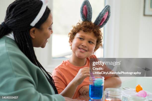 dyeing easter eggs - black dye stock pictures, royalty-free photos & images