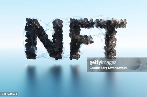 abstract black letters non-fungible token on a blue background. - non fungible token stockfoto's en -beelden