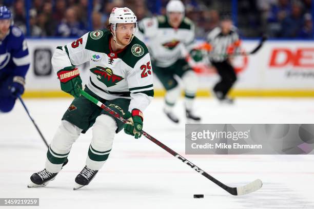 Jonas Brodin of the Minnesota Wild looks to pass in the first period during a game against the Tampa Bay Lightning at Amalie Arena on January 24,...